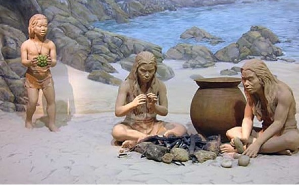 A photo of a family during stoneage times.