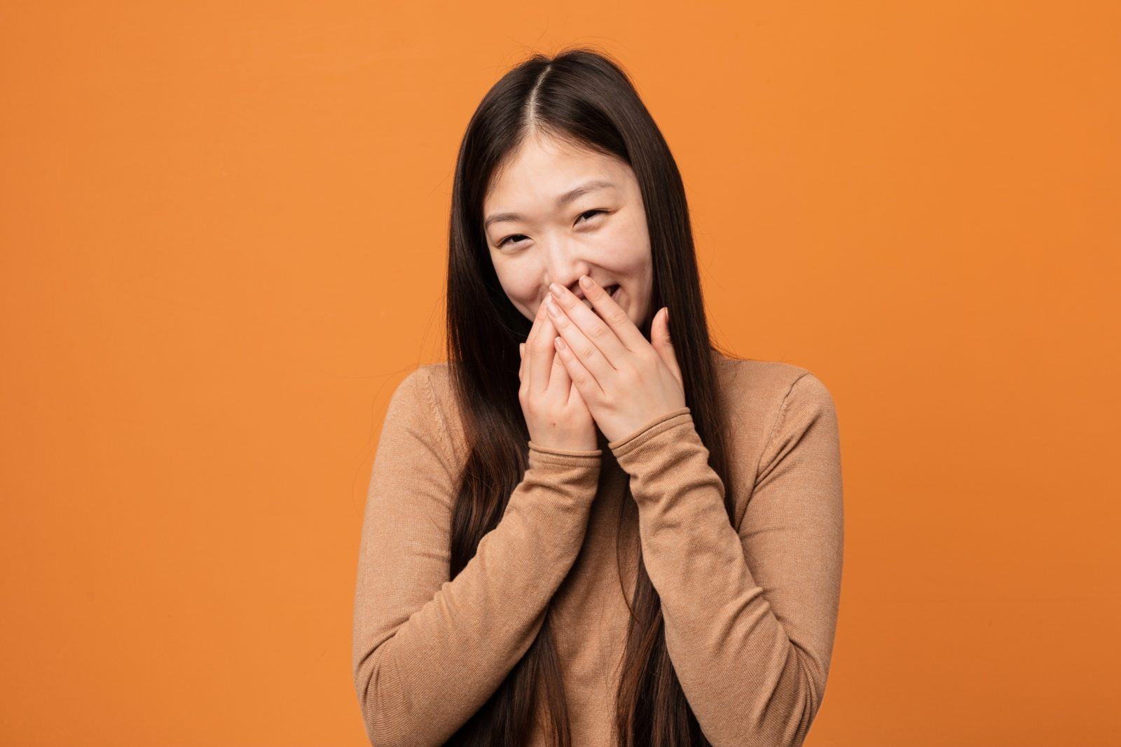 Chinese lady laughing at something funny