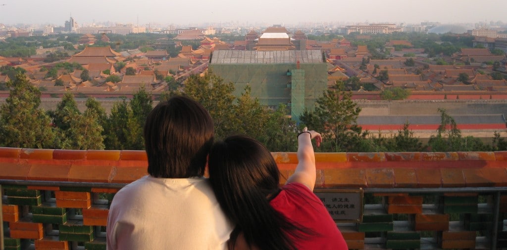 Couple sits overlooking Beijing