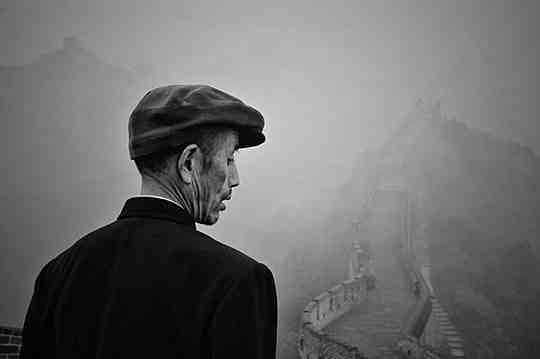 A Chinese man overlooks the Great Wall of China
