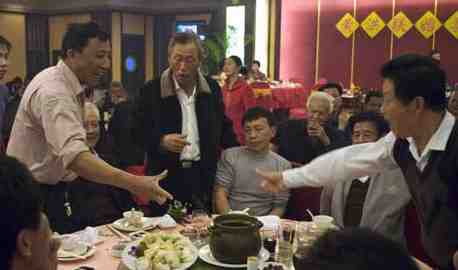 A Chinese toasting game at a restaurant