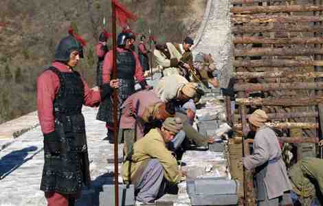 A reenactment of the construction of the Great Wall of China using thousands of laborers.