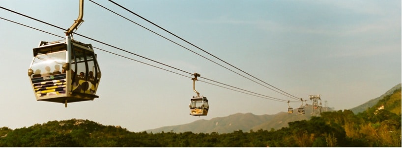ngong-ping-360-lantau People riding a scenic chair lift
